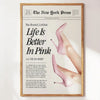 A framed print featuring a woman's leg in pink high heels and text about life being better in pink.