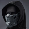 A close-up of a tactical silicone half-face mask worn under a black hood.