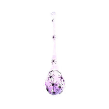 A purple Halloween glowing spider web decoration with light-up eggs.