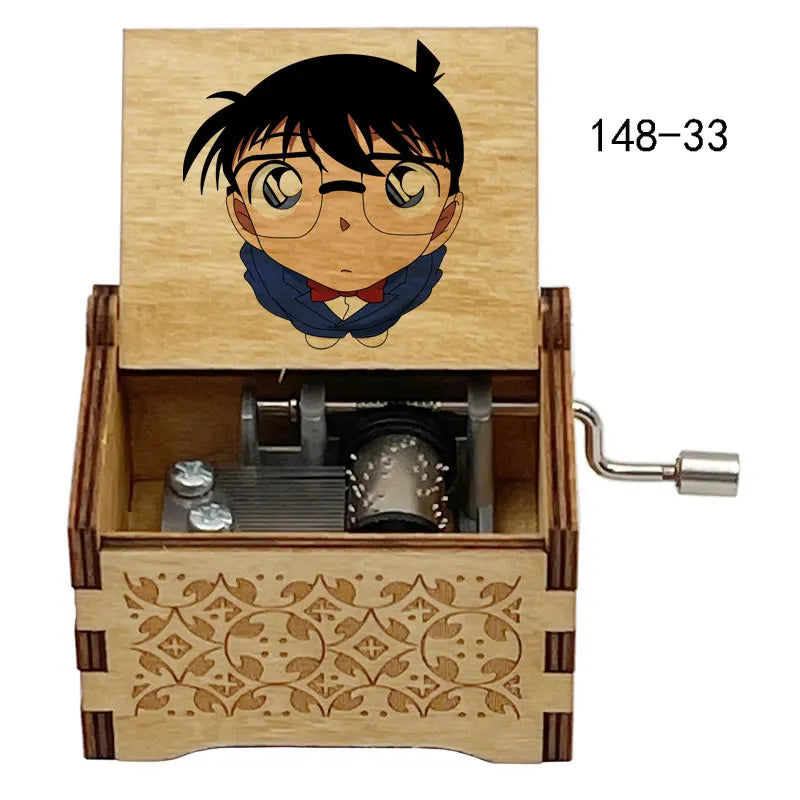 A wooden music box featuring an anime character design of a boy with black hair and glasses.