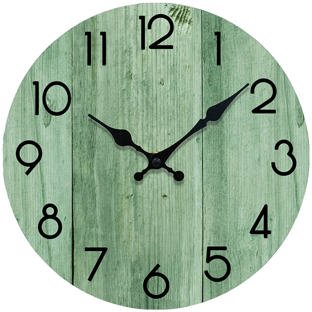 A minimalist wooden wall clock with a green weathered wood background and black hands.