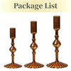 A set of three amber glass tapered candle holders with ruffled bases.