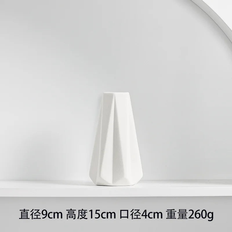 White hand-frosted ceramic tabletop vase, 9cm high, 4cm diameter, weighing 260g.
