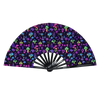 A folding rave hand fan with a dark purple background covered in colorful fluorescent mushrooms and plants.
