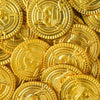 A pile of gold pirate coins used as party favors.
