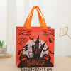 Orange tote bag featuring black silhouette designs of bats and spooky elements for Halloween