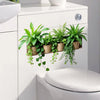 A white cabinet features potted green plants hanging from a wooden tray above a toilet.