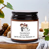 A dark glass jar candle with a white label featuring the names Daniel & Canla and the date 12.12.2025