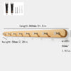 A wooden wall hook rack with four hooks made of solid beech wood.