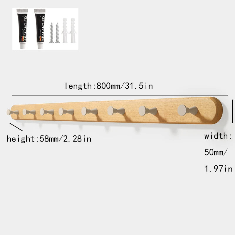 A wooden wall hook rack with four hooks made of solid beech wood.