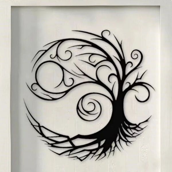 Black silhouette of a stylized tree with intricate branches and swirling leaves on a white wall.