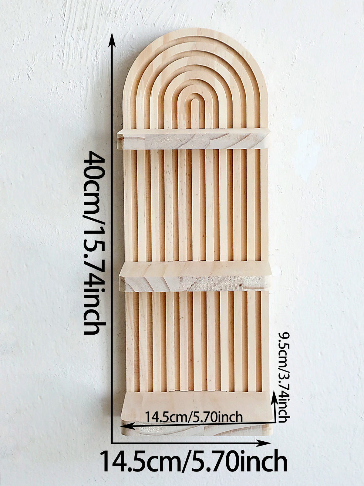 A vertical wooden wall shelf with a curved, ribbed design, measuring 40cm high and 14.5cm wide.
