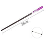 A purple magic wand with a black shaft and white accents, shown diagonally.