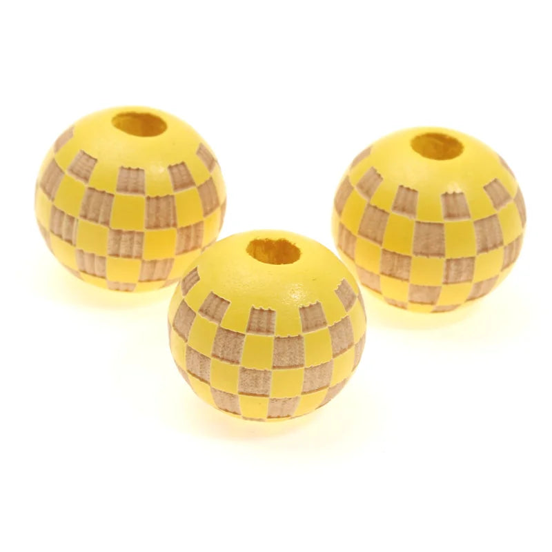 Two natural wooden checkered beads for jewelry making, yellow and brown.
