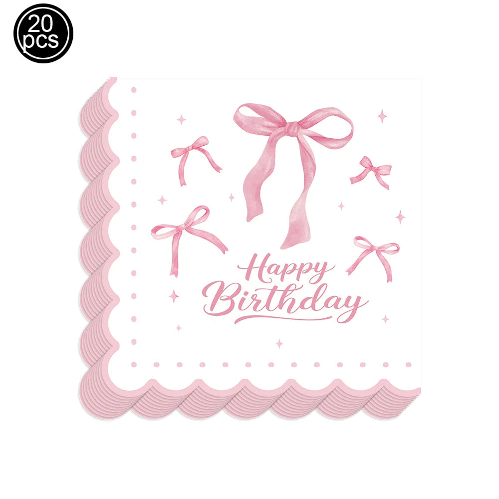 A set of pink bow themed birthday party supplies featuring a decorative ribbon bow and text.