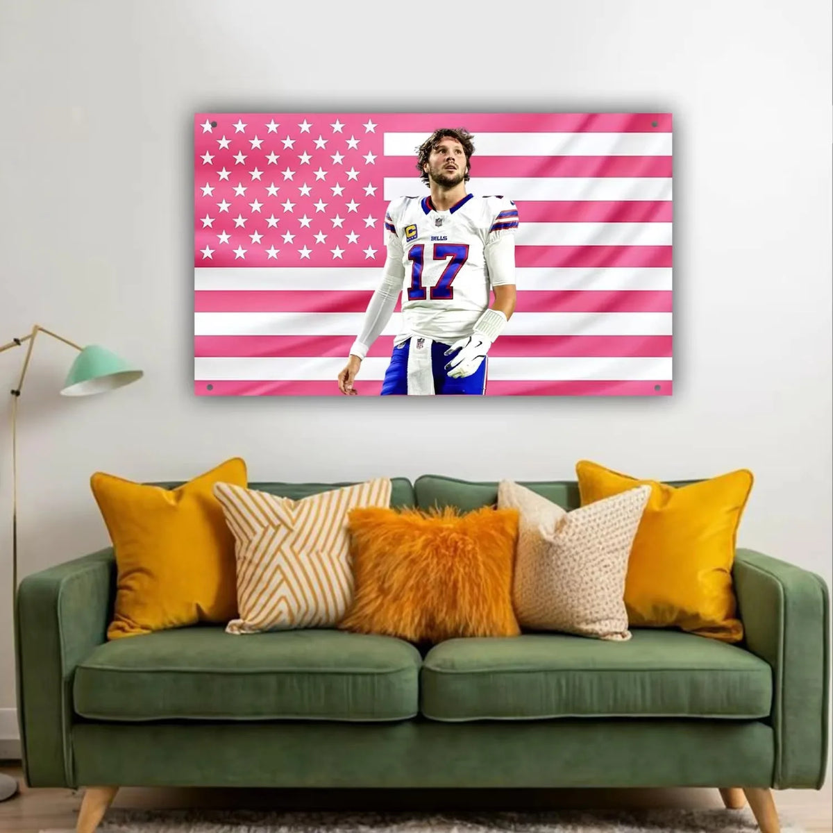 A framed tapestry featuring the American flag design with pink and white stripes and stars, displayed on a wall.