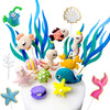 A set of colorful ocean animal cake toppers including a crab, turtle, octopus, whale, starfish, and shell decor.