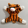 An orange and black striped tiger plush toy with a white snout and paws.