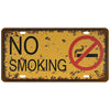 A vintage, distressed metal tin sign with the text NO SMOKING and a red circle prohibition symbol on a mustard yellow backgro
