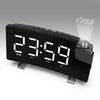 A black projection alarm clock with a large LED display showing 23:59 and various function buttons.
