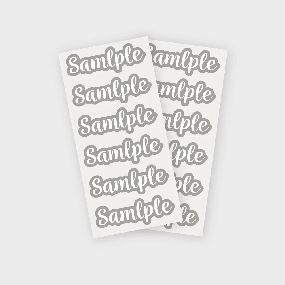 A sheet of white stickers with repeated gray text spelling out Sample, designed for personalization.