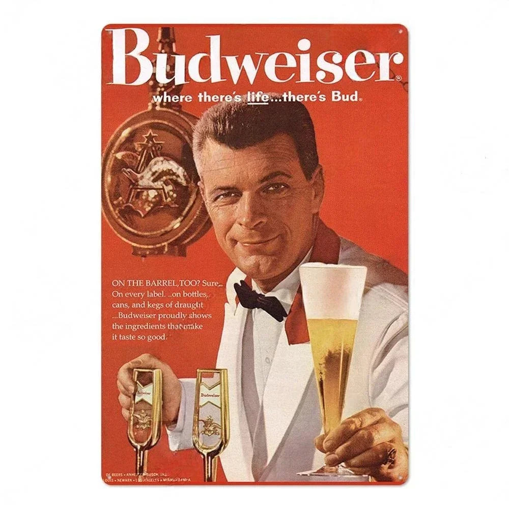 A man holds a glass of beer while a vintage beer metal sign set is displayed in the foreground.