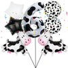 A set of black and white cow print balloons shaped like the number 6 and various other animal shapes for a party.