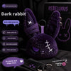 A dark purple rabbit plush toy with a bandage design and keychain attached.