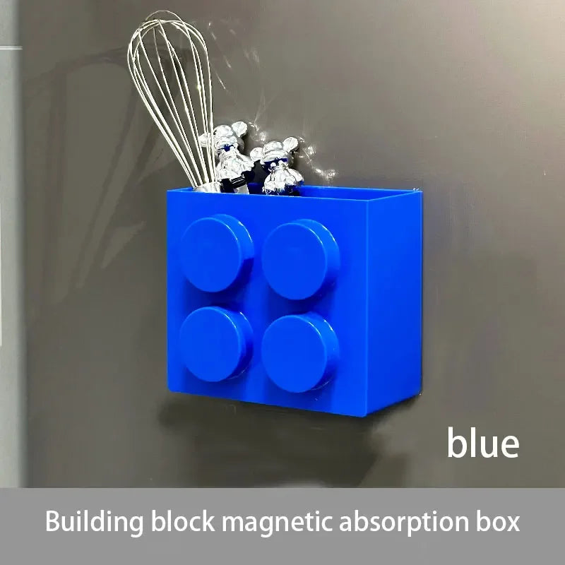 Blue magnetic absorption box with wires and small toys mounted on a gray wall.