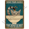 Vintage metal sign featuring a cat drinking from a sink with the text Wash Your Hands and The Soap Is Not Just for Decoration