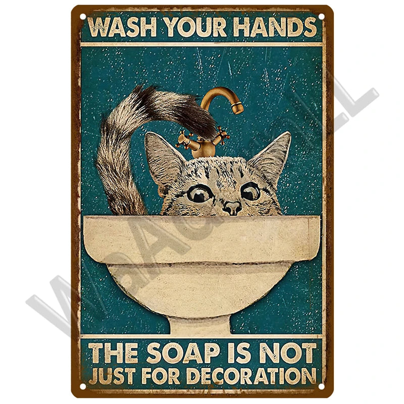 Vintage metal sign featuring a cat drinking from a sink with the text Wash Your Hands and The Soap Is Not Just for Decoration
