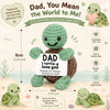 A handmade crochet turtle doll with a heart, featuring a tag that reads Dad I turtle you love you.