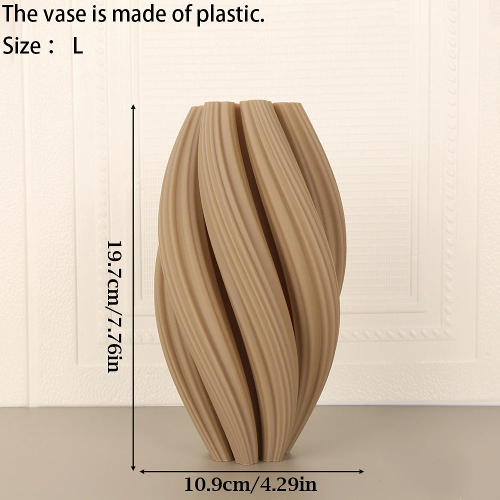 A tall, textured vase made of plastic in soft morandi tones, shown from the side.