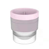 A stackable spherical ice mold for whiskey and cocktails with a pink and clear design.
