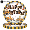 A circular plate with the words HAPPY BIRTHDAY decorated with construction trucks and tools for a party.
