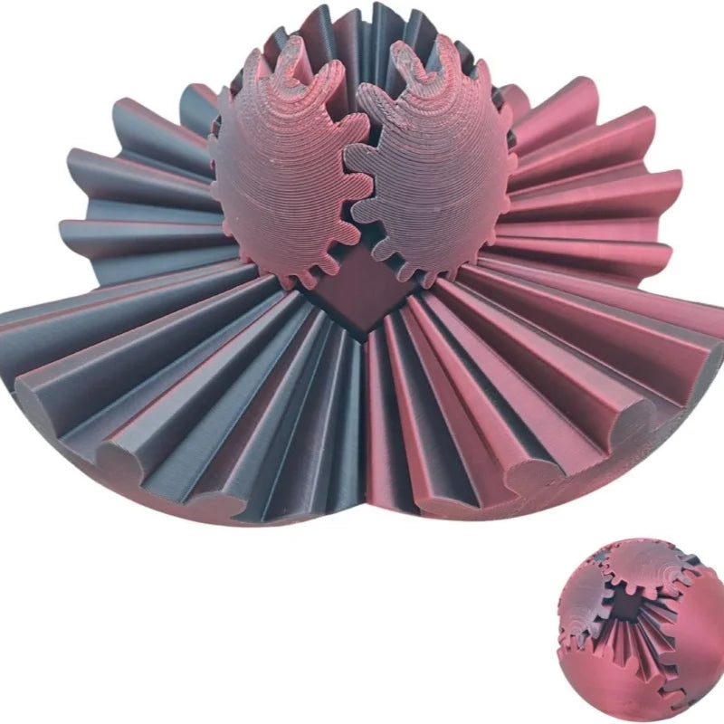A pink and gray 3D printed gear ball fidget spinner with layered, ribbed components.
