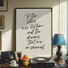 A framed print featuring a literary quote on a white background displayed in a modern interior setting.