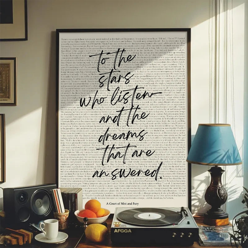 A framed print featuring a literary quote on a white background displayed in a modern interior setting.