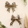 A wall mounted storage rack featuring leopard print decorative hooks and shelves.