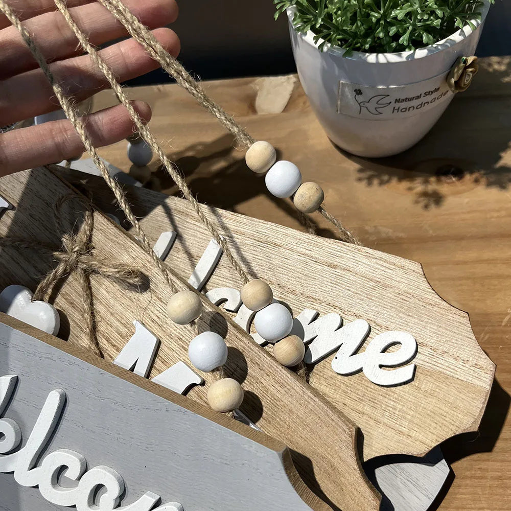 Rustic wooden door welcome sign with natural twine and wooden beads
