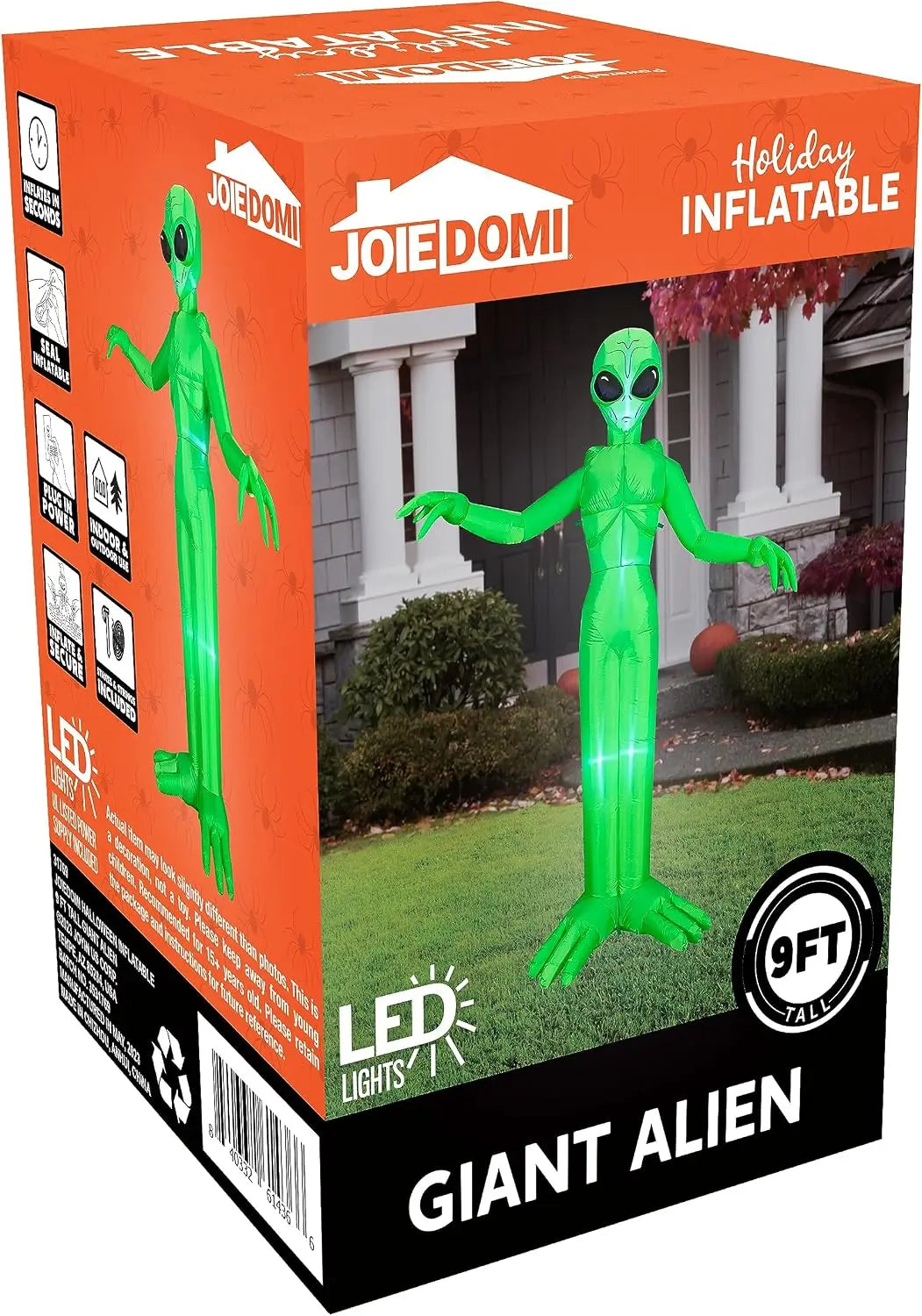 A green giant alien inflatable decoration with LED lights displayed in an orange box.