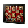 A black display frame featuring multiple framed photos with gold ornate borders and internal lighting.