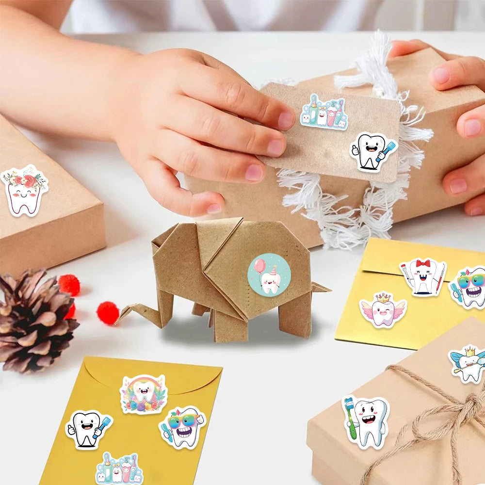 A collection of cartoon tooth fairy stickers and a gift box are shown with a child's hand interacting with the stickers.