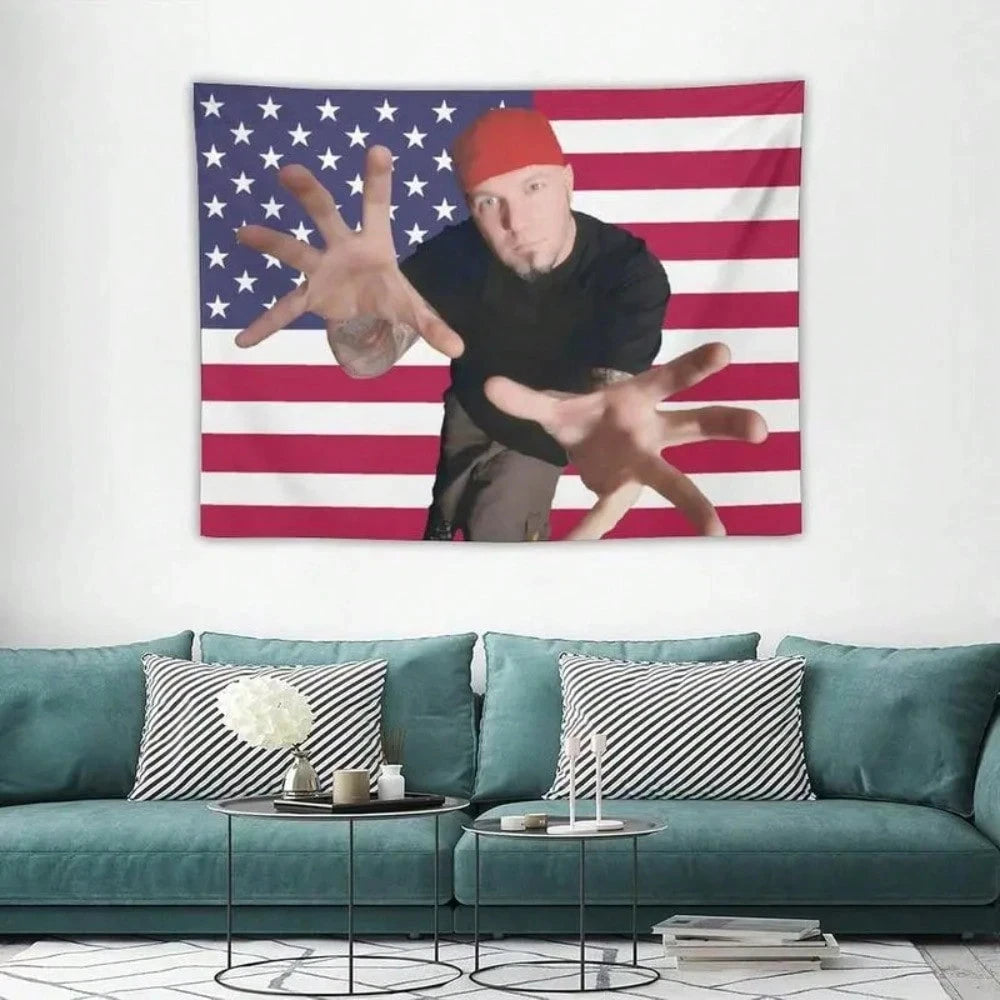 A tapestry featuring a hand gesture against an American flag background.