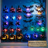 A display of 30 black LED Halloween wall stickers featuring various spooky silhouettes and faces on a glass surface.