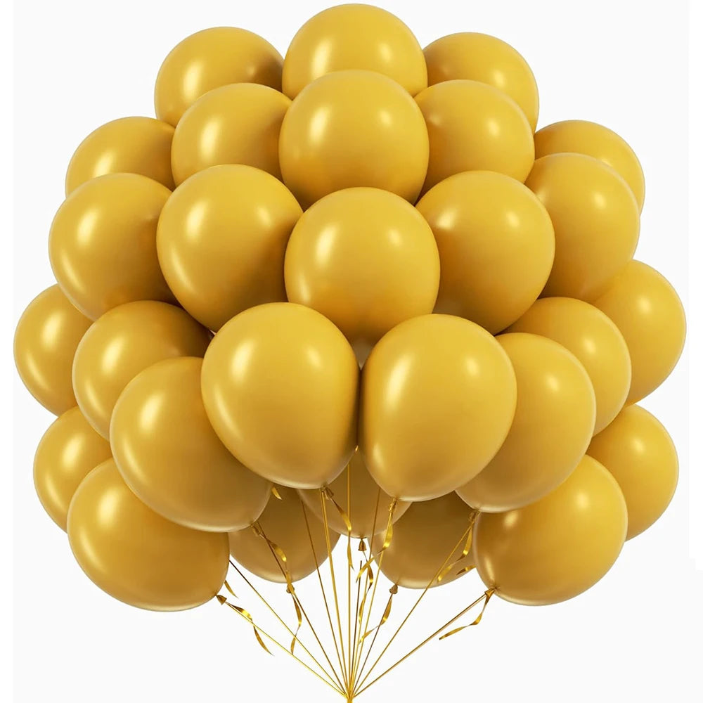 A bunch of assorted yellow latex party balloons tied together with gold strings.