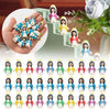 A collection of mini Maria religious desktop figurines in various colors arranged on a staircase.