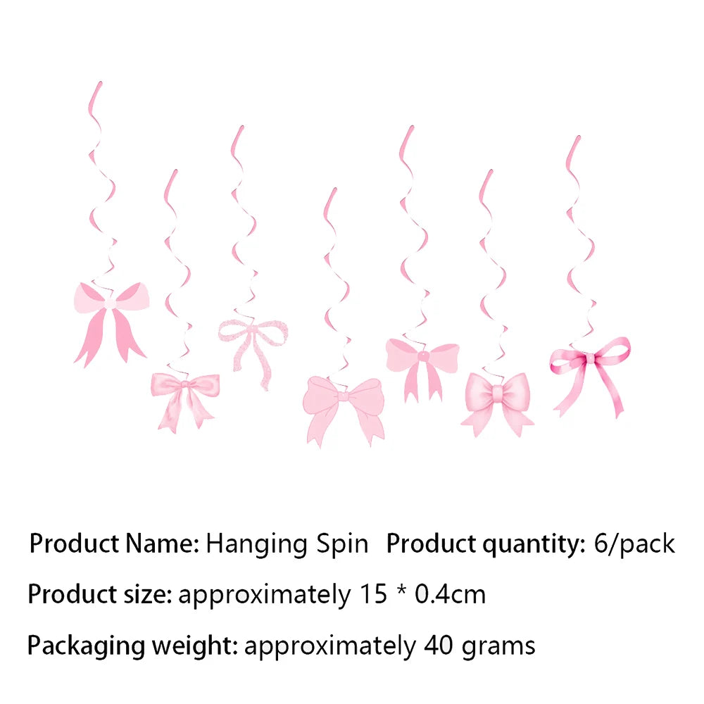 A set of pink hanging spin bows used as disposable party tableware