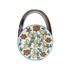A silver handbag hook with a floral crystal design featuring orange and yellow elements.