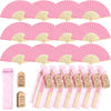 Pink paper hand fans with gold accents packaged in gift bags and thank you cards